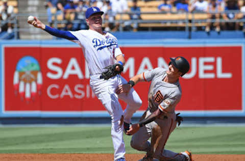 LOS ANGELES, CA – SEPTEMBER 08: Mike Yastrzemski #5 of the San Francisco Giants is out at second as Gavin Lux #48 of the Los Angeles Dodgers fields the ball hit by Jaylin Davis #49 of the San Francisco Giants but is unable to make the out at first in the first inning of the game at Dodger Stadium on September 8, 2019 in Los Angeles, California. (Photo by Jayne Kamin-Oncea/Getty Images)