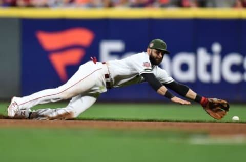 CINCINNATI, OH – SEPTEMBER 20: Jose Peraza #9 of the Cincinnati Reds dives for a single hit by Jeff McNeil #6 of the New York Mets in the eighth inning at Great American Ball Park on September 20, 2019 in Cincinnati, Ohio. New York defeated Cincinnati 8-1. (Photo by Jamie Sabau/Getty Images)