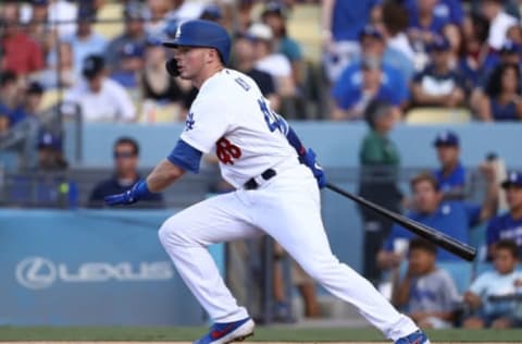 LOS ANGELES, CALIFORNIA – SEPTEMBER 02: Gavin Lux #48 of the Los Angeles Dodgers hits a single to center field in the second inning of the MLB game against the Colorado Rockies at Dodger Stadium on September 02, 2019 in Los Angeles, California. (Photo by Victor Decolongon/Getty Images)