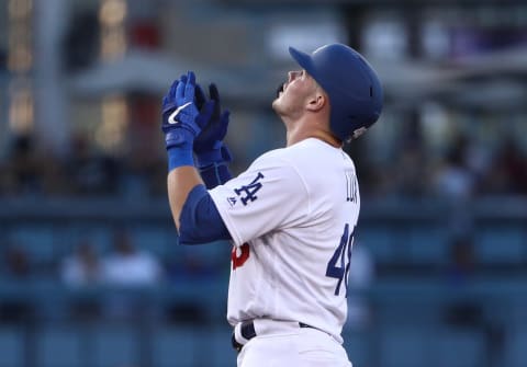 LOS ANGELES, CALIFORNIA – SEPTEMBER 02: Gavin Lux #48 of the Los Angeles Dodgers points and looks to the sky from second base after hitting a double to center field in the third inning of the MLB game against the Colorado Rockies at Dodger Stadium on September 02, 2019 in Los Angeles, California. (Photo by Victor Decolongon/Getty Images)