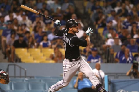 LOS ANGELES, CALIFORNIA - SEPTEMBER 03: Nolan Arenado #28 of the Colorado Rockies hits a solo home run in the fourth inning of the MLB game against the Los Angeles Dodgers at Dodger Stadium on September 03, 2019 in Los Angeles, California. (Photo by Victor Decolongon/Getty Images)