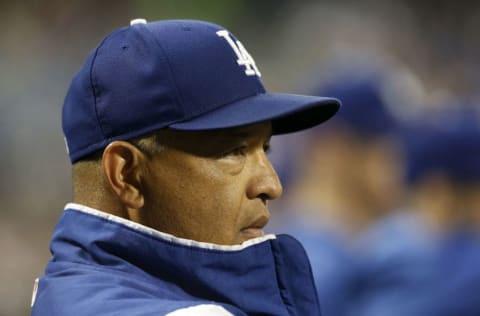 NEW YORK, NEW YORK - SEPTEMBER 13: Manager Dave Roberts #30 of the Los Angeles Dodgers looks on from the dugout during the third inning against the New York Mets at Citi Field on September 13, 2019 in New York City. (Photo by Jim McIsaac/Getty Images)