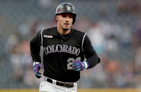 DENVER, COLORADO - SEPTEMBER 13: Nolan Arenado #28 of the Colorado Rockies circles the bases after hitting a 2 RBI home run in the first inning against the San Diego Padres at Coors Field on September 13, 2019 in Denver, Colorado. (Photo by Matthew Stockman/Getty Images)