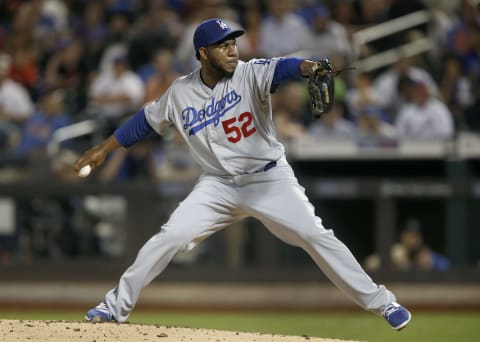 NEW YORK, NEW YORK – SEPTEMBER 15: Pedro Baez #52 of the Los Angeles Dodgers pitches against the New York Mets at Citi Field on September 15, 2019 in New York City. The Dodgers defeated the Mets 3-2. (Photo by Jim McIsaac/Getty Images)