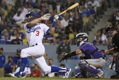 LOS ANGELES, CA – SEPTEMBER 20: Chris Taylor #3 of the Los Angeles Dodgers at bat while Tony Wolters #14 of the Colorado Rockies looks on at Dodger Stadium on September 20, 2019 in Los Angeles, California. The Dodgers won 12-5. (Photo by John McCoy/Getty Images)