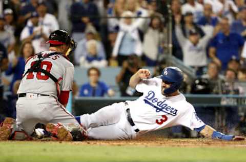 LOS ANGELES, CALIFORNIA – OCTOBER 03: Chris Taylor #3 of the Los Angeles Dodgers is is tagged out at home by catcher Yan Gomes #10 of the Washington Nationals after an RBI single hits a by Max Muncy #13 in the fifth inning of game one of the National League Division Series at Dodger Stadium on October 03, 2019 in Los Angeles, California. (Photo by Sean M. Haffey/Getty Images)