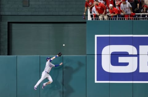 WASHINGTON, DC – OCTOBER 07: Cody Bellinger #35 of the Los Angeles Dodgers leaps to catch a sacrifice fly hit by Anthony Rendon #6 of the Washington Nationals to drive in a run in the sixth inning of game four of the National League Division Series at Nationals Park on October 07, 2019 in Washington, DC. (Photo by Rob Carr/Getty Images)