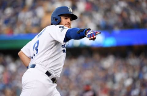 LOS ANGELES, CALIFORNIA – OCTOBER 09: Max Muncy #13 of the Los Angeles Dodgers celebrates his two run home run in the first inning of game five of the National League Division Series against the Washington Nationals at Dodger Stadium on October 09, 2019 in Los Angeles, California. (Photo by Harry How/Getty Images)