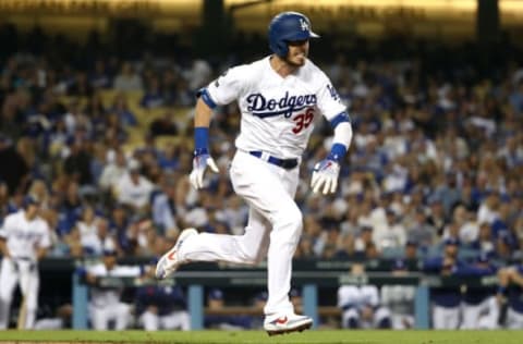 LOS ANGELES, CALIFORNIA – OCTOBER 09: Cody Bellinger #35 of the Los Angeles Dodgers runs to first on an error in the third inning of game five of the National League Division Series against the Washington Nationals at Dodger Stadium on October 09, 2019 in Los Angeles, California. (Photo by Sean M. Haffey/Getty Images)