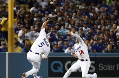 LOS ANGELES, CALIFORNIA – OCTOBER 09: Corey Seager #5 of the Los Angeles Dodgers drops the ball next to Kike Hernandez #14 on a Juan Soto #22 of the Washington Nationals double in the fourth inning of game five of the National League Division Series at Dodger Stadium on October 09, 2019 in Los Angeles, California. (Photo by Sean M. Haffey/Getty Images)