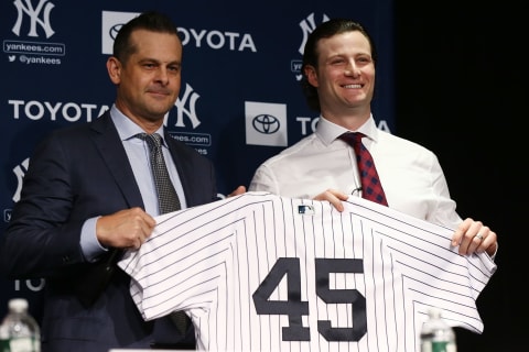 Gerrit Cole revealing his new Yankees jersey (Photo by Mike Stobe/Getty Images)