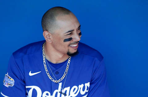 GLENDALE, ARIZONA - FEBRUARY 24: Mookie Betts #50 of the Los Angeles Dodgers looks on from the dugout prior to a Cactus League spring training game against the Chicago White Sox at Camelback Ranch on February 24, 2020 in Glendale, Arizona. (Photo by Ralph Freso/Getty Images)