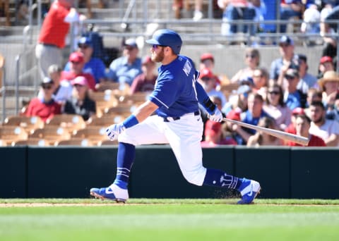 GLENDALE, ARIZONA – FEBRUARY 26: Max Muncy #13 of the Los Angeles Dodgers follows through on a swing during a spring training game against the Los Angeles Angels at Camelback Ranch on February 26, 2020 in Glendale, Arizona. (Photo by Norm Hall/Getty Images)