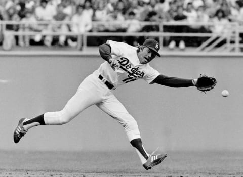 LOS ANGELES, CA – April 26, 1981: Bill Russell #18 of the Los Angeles Dodgers, reaches for a ball during a game against the San Diego Padres at Dodger Stadium, Los Angeles, California. (Photo by Jayne Kamin-Oncea/Getty Images)