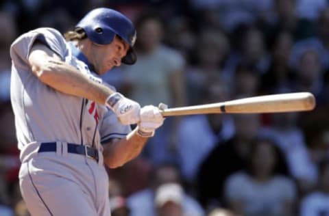 Against the Boston Red Sox, Los Angeles Dodgers batter Shawn Green connects at Fenway Park in Boston, Massachusetts on June 12, 2004. (Photo by J Rogash/Getty Images)