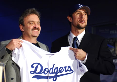 Los Angeles Dodgers general manager Ned Colletti (left) and Nomar Garciaparra pose at press conference to announce signing of Garciaparra to a one-year contract at Dodger Stadium in Los Angeles, Calif. on Monday, December 19, 2005. (Photo by Kirby Lee/Getty Images)