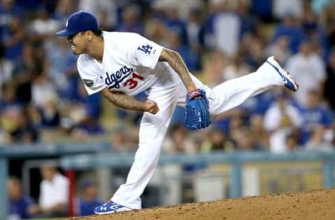 LOS ANGELES, CA – SEPTEMBER 29: Closer Brandon League #31 of the Los Angeles Dodgers pitches in the ninth inning on his way to picking up the save against the Colorado Rockies on September 29, 2012 at Dodger Stadium in Los Angeles, California. The Dodgers won 3-0. (Photo by Stephen Dunn/Getty Images)