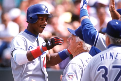 Darryl Strawberry celebrates with Tommy Lasorda. (Credit: Otto Greule/ALLSPORT)