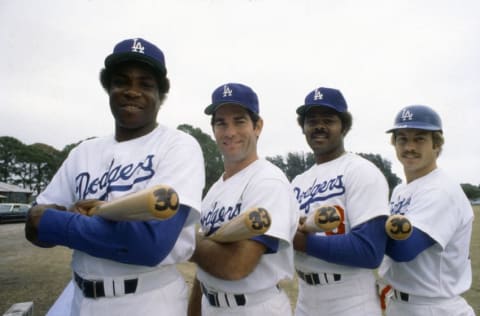 VERO BEACH, FL - CIRCA 1977: (L-R) Dusty Baker #12, Steve Garvey #6, Reggie Smith #8 and Ron Cey #10 of the Los Angeles Dodgers poses together for this portrait during Major League Baseball spring training circa 1977 at Holman Stadium in Vero Beach, Florida. The number at the end of each bat displays the amount of home runs each player hit the previous season. (Photo by Focus on Sport/Getty Images)