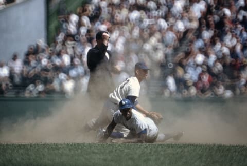 NEW YORK – CIRCA 1962: Jim Gilliam #19 of the Los Angeles Dodgers in action against the New York Mets during an Major League Baseball game circa 1962 at the Polo Grounds in the Manhattan borough of New York City. Gilliam played for the Brooklyn/Los Angeles Dodgers from 1953-66. (Photo by Focus on Sport/Getty Images)