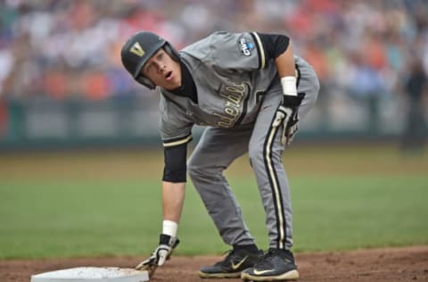 Omaha, NE – June 23: Base runner Jeren Kendall #3 of the Vanderbilt Commodores reacts after getting picked off of first base against the Virginia Cavaliers in the second inning during game two of the College World Series Championship Series on June 23, 2015, at TD Ameritrade Park in Omaha, Nebraska. (Photo by Peter Aiken/Getty Images)