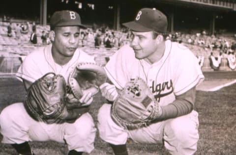 BROOKLYN, NY - 1953: Brooklyn Dodgers catchers Roy Campanella, left, and Rube Walker (1926 - 1992), compare mitts before a game in 1953 at Ebbets Field in Brooklyn, New York. (Photo Reproduction by Transcendental Graphics/Getty Images)