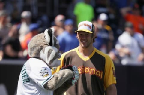 SAN DIEGO, CA – JULY 11: Arizona Diamondbacks mascot D. Baxter The Bobcat talks to Clayton Kershaw