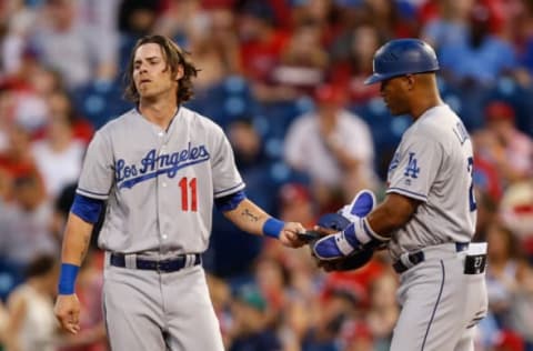 PHILADELPHIA, PA – AUGUST 18: Josh Reddick #11 of the Los Angeles Dodgers hands his helmet to first base coach George Lombard #27 after hitting a long fly for the last out of the top of the third inning of the game against the Los Angeles Dodgers at Citizens Bank Park on August 18, 2016 in Philadelphia, Pennsylvania. (Photo by Brian Garfinkel/Getty Images)