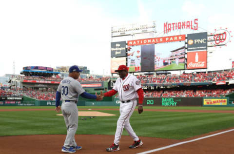 WASHINGTON, DC – OCTOBER 7: Manager Dusty Baker #12 of the Washington Nationals shakes hands with manager Dave Roberts #30 of the Los Angeles Dodgers prior to game one of the National League Division Series at Nationals Park on October 7, 2016 in Washington, DC. (Photo by Rob Carr/Getty Images)