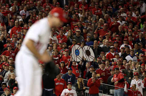 WASHINGTON, DC – OCTOBER 13: Fans hold signs showing the eyes of Max Scherzer #31 of the Washington Nationals during game five of the National League Division Series between the Los Angeles Dodgers and the Washington Nationals at Nationals Park on October 13, 2016 in Washington, DC. (Photo by Patrick Smith/Getty Images)