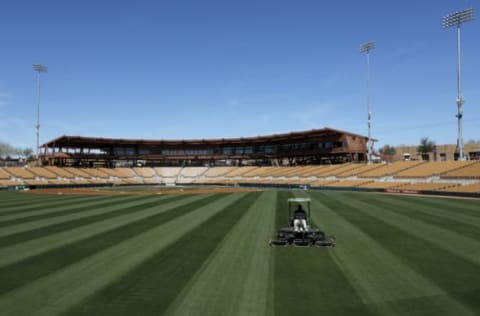 GLENDALE, AZ – MARCH 07: A grounds crew member mows the outfield before the spring training game between the Los Angeles Dodgers and the San Francisco Giants at Camelback Ranch on March 7, 2017 in Glendale, Arizona. (Photo by Tim Warner/Getty Images)