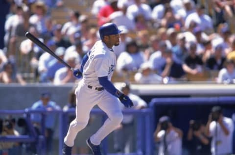 18 Aug 2000: Gary Sheffield #10 of the Los Angeles Dodgers drops the bat after his swing during the game against the New York Mets at Dodger Stadium in Los Angeles, California. The Dodgers defeated the Mets 1-4.Mandatory Credit: Stephen Dunn /Allsport