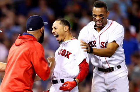 BOSTON, MA – AUGUST 16: Mookie Betts #50 of the Boston Red Sox celebrates with David Price #24 and Xander Bogaerts #2 after hitting a go ahead two run double to defeat the St. Louis Cardinals 5-4 at Fenway Park on August 16, 2017 in Boston, Massachusetts. (Photo by Maddie Meyer/Getty Images)