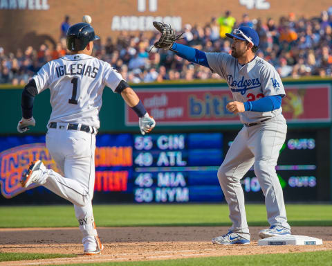 DETROIT, MI – AUGUST 19: Adrian Gonzalez #23 of the Los Angeles Dodgers reaches for the throw at first base for an out on Jose Iglesias #1 of the Detroit Tigers during a MLB game at Comerica Park on August 19, 2017 in Detroit, Michigan. The Dodgers defeated the Tigers 3-0. (Photo by Dave Reginek/Getty Images)