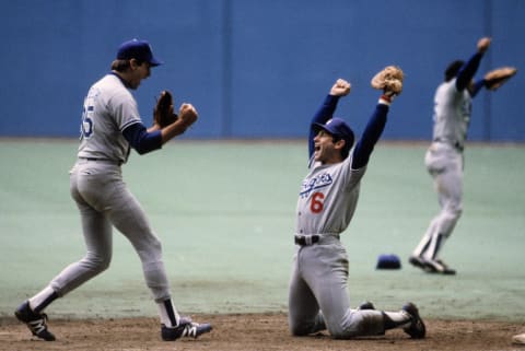 MONTREAL – OCTOBER 19: Steve Garvey #6 and pitcher Bob Welch #35 of the Los Angeles Dodgers celebrate after winning the National League Championship Series (Photo by Ronald C. Modra/Getty Images)