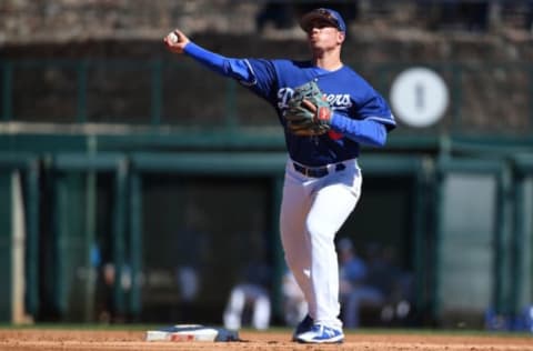 GLENDALE, AZ – MARCH 03: Omar Estevez #0 of the Los Angeles Dodgers turns the double play against the Arizona Diamondbacks in the second inning of the spring training at Camelback Ranch on March 3, 2018 in Glendale, Arizona. (Photo by Jennifer Stewart/Getty Images)