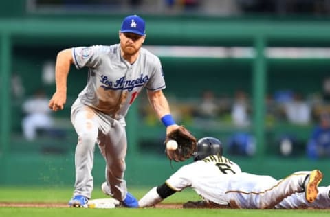 PITTSBURGH, PA – JUNE 06: Starling Marte #6 of the Pittsburgh Pirates safely steals second base in front of Logan Forsythe #11 of the Los Angeles Dodgers during the second inning at PNC Park on June 6, 2018 in Pittsburgh, Pennsylvania. (Photo by Joe Sargent/Getty Images)