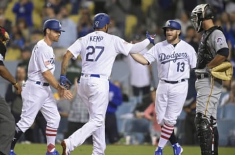 LOS ANGELES, CA – JULY 02: Matt Kemp #27 of the Los Angeles Dodgers is congratulated for his 3 run home run by Logan Forsythe #11 and Max Muncy #13 as Jacob Stallings #58 of the Pittsburgh Pirates looks on at the plate in the sixth inning at Dodger Stadium on July 2, 2018, in Los Angeles, California. (Photo by John McCoy/Getty Images)