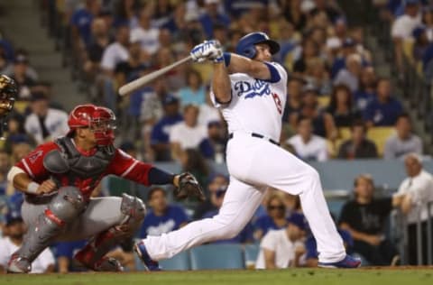 LOS ANGELES, CA – JULY 13: Max Muncy #13 of the Los Angeles Dodgers hits an rbi single to deep right field during the seventh inning of their MLB game against the Los Angeles Angels of Anaheim at Dodger Stadium on July 13, 2018 in Los Angeles, California. (Photo by Victor Decolongon/Getty Images)