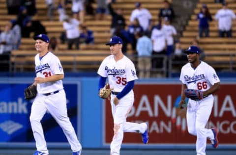 LOS ANGELES, CA – MAY 18: Joc Pederson #31, Cody Bellinger #35 and Yasiel Puig #66 of the Los Angeles Dodgers react to a 7-2 win over the Miami Marlins as they leave the outfield at Dodger Stadium on May 18, 2017 in Los Angeles, California. (Photo by Harry How/Getty Images)