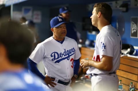 LOS ANGELES, CA – JUNE 26: Dave Roberts #30 of the Los Angeles Dodgers has a chat with Rich Hill #44 of the Los Angeles Dodgers after the 6th inning against the Los Angeles Angels at Dodger Stadium on June 26, 2017, in Los Angeles, California. (Photo by Joe Scarnici/Getty Images)