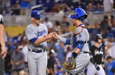 Yasmani Grandal #9 of the Los Angeles Dodgers congratulates pitcher Brock Stewart #48 after defeating the Miami Marlins at Marlins Park on July 15, 2017, in Miami, Florida. (Photo by Eric Espada/Getty Images)