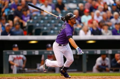 DENVER, CO – AUGUST 15: Nolan Arenado #28 of the Colorado Rockies watches his solo home run during the first inning against the Atlanta Braves at Coors Field on August 15, 2017, in Denver, Colorado. (Photo by Justin Edmonds/Getty Images)