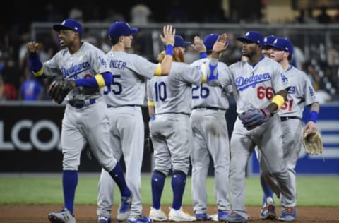 SAN DIEGO, CA – SEPTEMBER 1: Los Angeles Dodgers players high five after beating the San Diego Padres 1-0 in a baseball game at PETCO Park on September 1, 2017, in San Diego, California. (Photo by Denis Poroy/Getty Images)