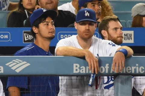 LOS ANGELES, CA – SEPTEMBER 06: Dodgers’ Yu Darvish, Logan Forsythe, and Tony Cingrani