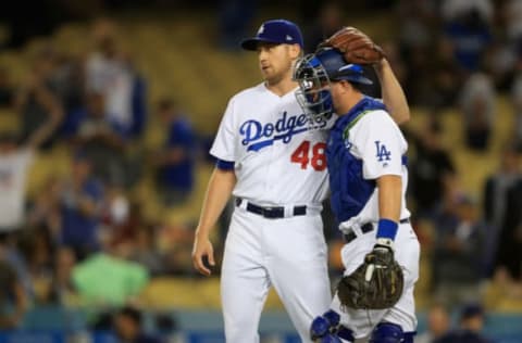 LOS ANGELES, CA – SEPTEMBER 26: Brock Stewart #48 hugs Yasmani Grandal #9 of the Los Angeles Dodgers after defeating the San Diego Padres 9-2 in a game at Dodger Stadium on September 26, 2017 in Los Angeles, California. (Photo by Sean M. Haffey/Getty Images)