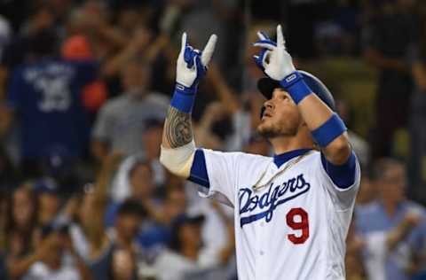 LOS ANGELES, CA – JUNE 08: Yasmani Grandal #9 of the Los Angeles Dodgers points to the sky as he crosses the plate after his second solo home run in the fourth inning of the game against the Atlanta Braves at Dodger Stadium on June 8, 2018 in Los Angeles, California. (Photo by Jayne Kamin-Oncea/Getty Images)