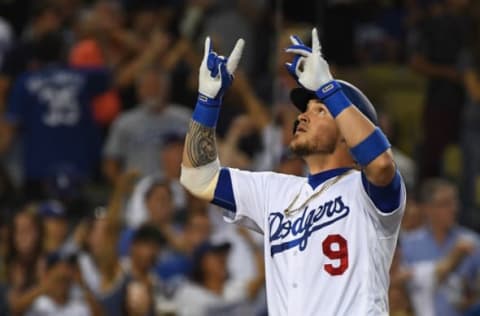 LOS ANGELES, CA – JUNE 08: Yasmani Grandal #9 of the Los Angeles Dodgers points to the sky as he crosses the plate after his second solo home run in the fourth inning of the game against the Atlanta Braves at Dodger Stadium on June 8, 2018, in Los Angeles, California. (Photo by Jayne Kamin-Oncea/Getty Images)