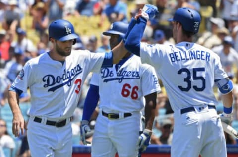 LOS ANGELES, CA – JUNE 10: Chris Taylor #3 of the Los Angeles Dodgers is congratulated by Yasiel Puig #66 and Cody Bellinger #35 after scoring in the third inning against the Atlanta Braves at Dodger Stadium on June 10, 2018, in Los Angeles, California. (Photo by John McCoy/Getty Images)