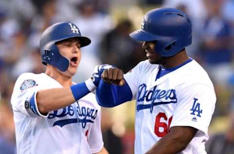 LOS ANGELES, CA – JUNE 12: Joc Pederson #31 of the Los Angeles Dodgers celebrates his two-run home run with Yasiel Puig #66 to take a 3-0 lead over the Texas Rangers during the second inning at Dodger Stadium on June 12, 2018, in Los Angeles, California. (Photo by Harry How/Getty Images)